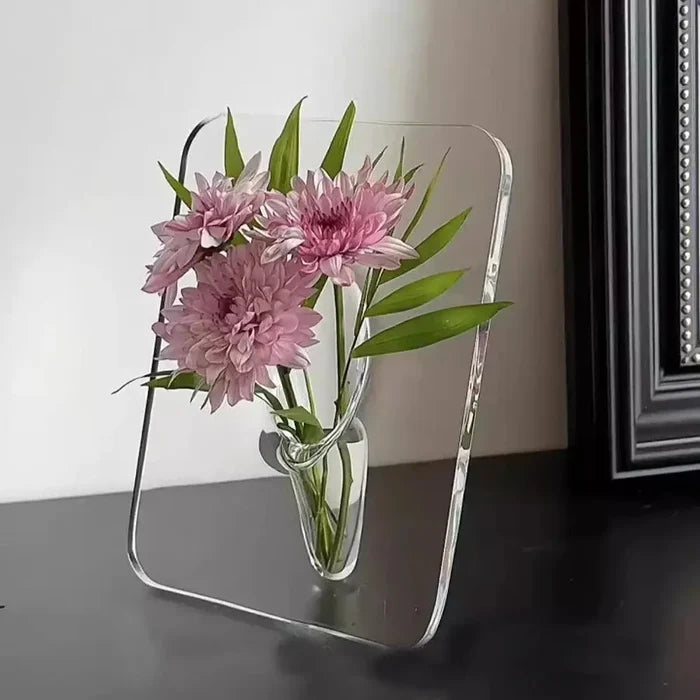 Acrylic Frame Vase with pink flowers and green leaves elegantly displayed in a clear acrylic frame, blending minimalist style with personalized handmade craft for home interior decor.