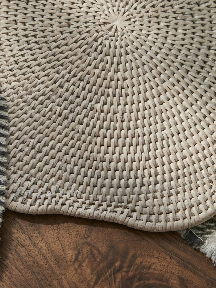 Ayre white scalloped rattan placemat close up showing handwoven texture and edge detail