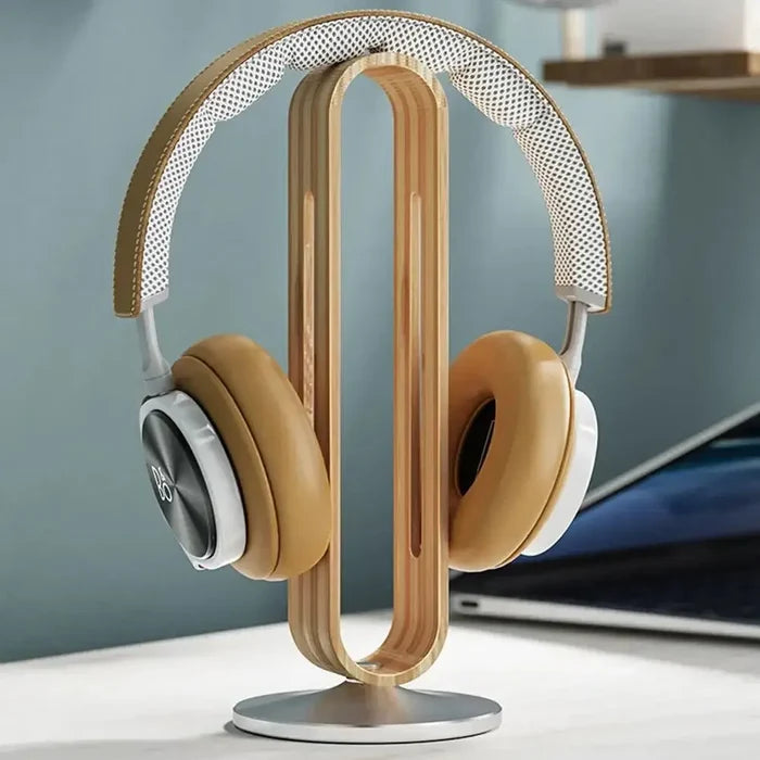 Bamboo Headphone Stand holding a pair of stylish over-ear headphones, showcasing a sleek, space-saving design crafted from high-quality wood for elegant home interior decor.