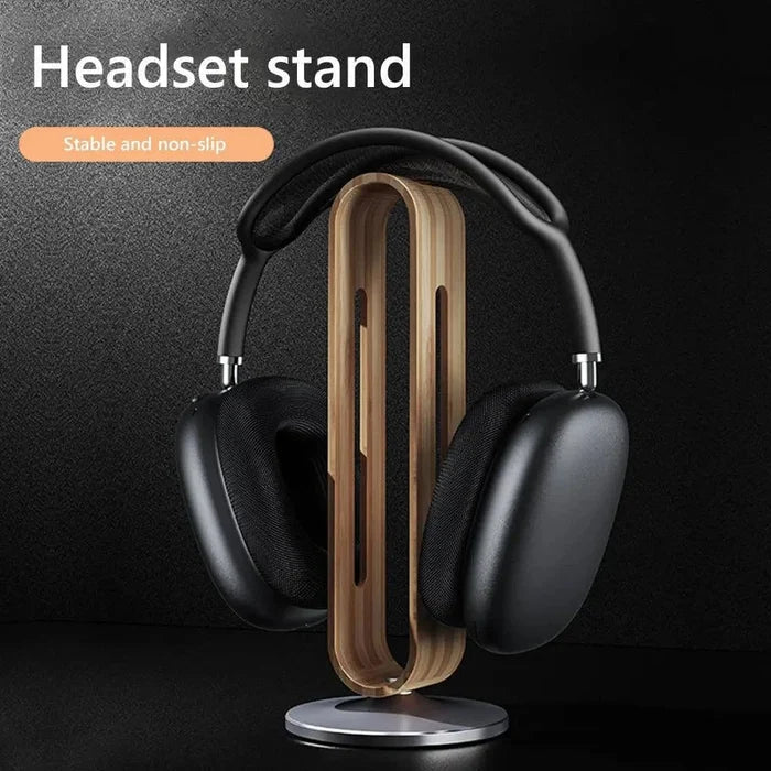 Bamboo Headphone Stand crafted from smooth wood with a sleek metal base, holding black over-ear headphones, showcasing a stable and non-slip design for organized home decor.