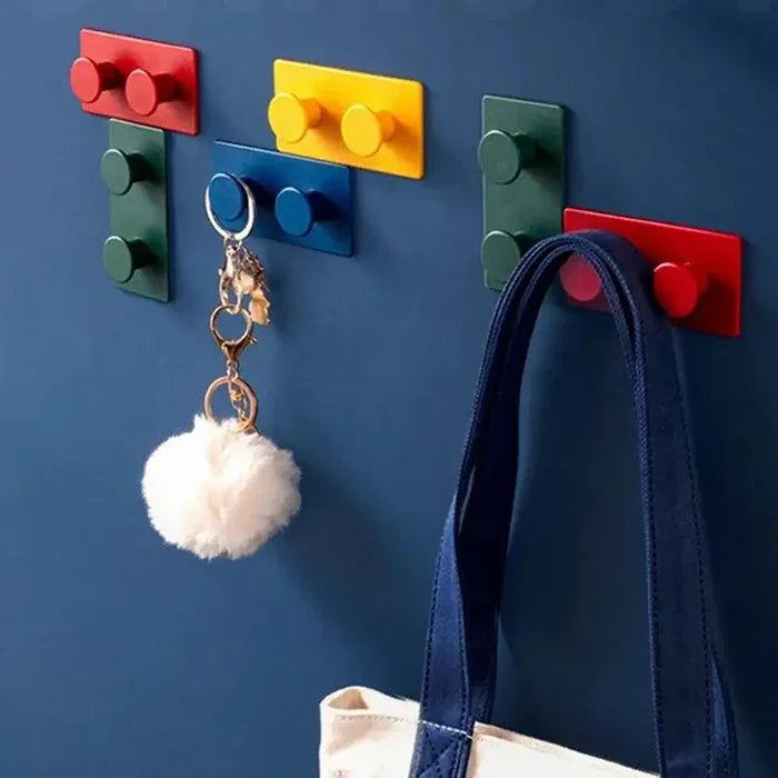 Block Key Hook wall-mounted in vibrant red, yellow, blue, and green, holding keys with a fluffy keychain and a canvas tote bag, blending practical handmade charm with stylish home decor.