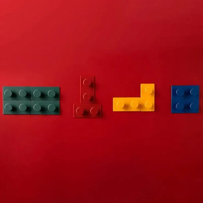 Colorful building blocks arranged on red background for playful home décor