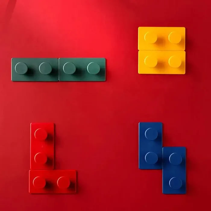 Colorful building blocks arranged on red background for playful home décor