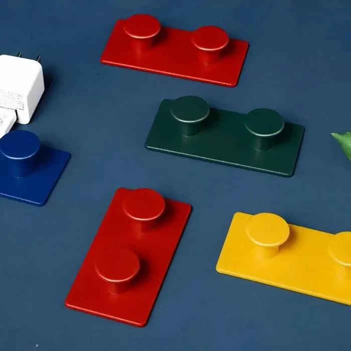 Colorful LEGO-style hooks for home organization and playful décor
