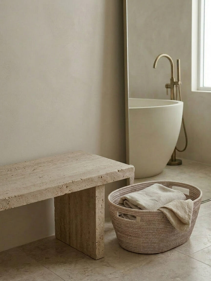 Medium white rattan storage basket Cesta with towels in modern bathroom setting, woven laundry basket neutral spa style UK
