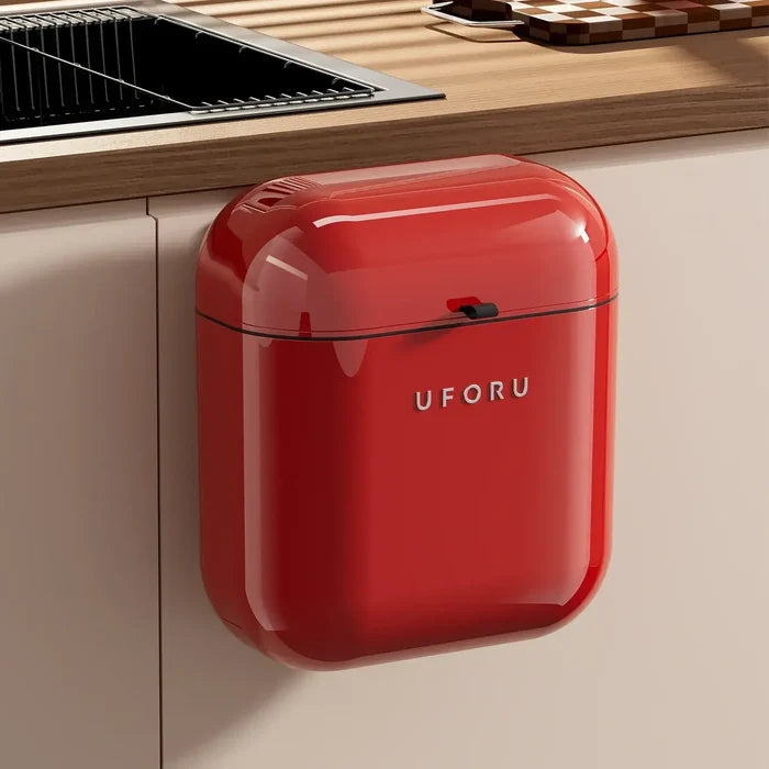 Red kitchen Waste Bin on a kitchen cabinet