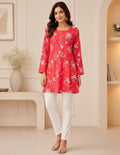 Coral pink floral printed tunic paired with white straight pants for women featuring a relaxed fit and elegant everyday style.