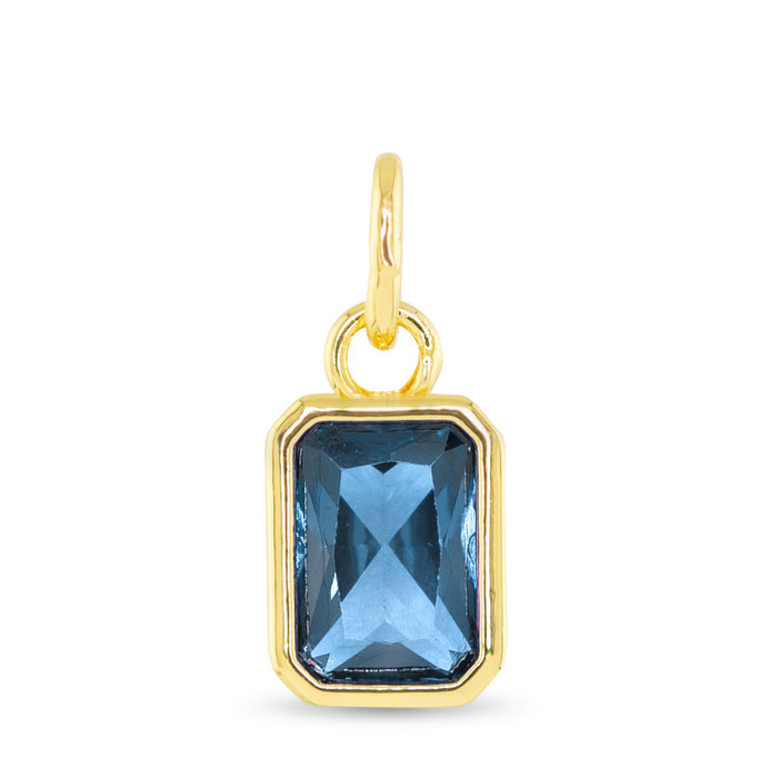 December birthstone charm with blue topaz-inspired faceted stone and 18K gold dipped setting
