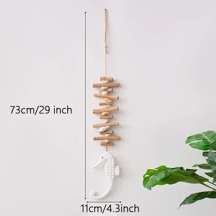 Decorative wall hanging with seahorse and wooden sticks, measurement details on a white background.
