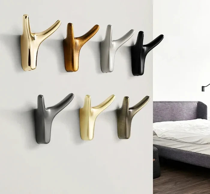 Modern wall hooks in gold, silver, black, and bronze for stylish home decor