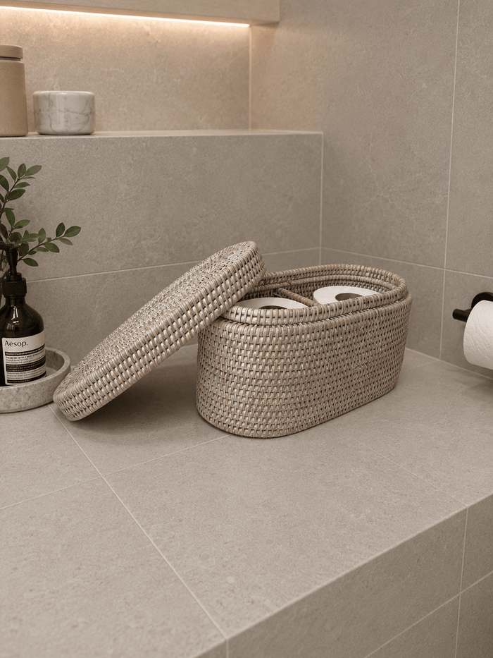 Jarra lidded basket with a lid on a tiled bathroom floor