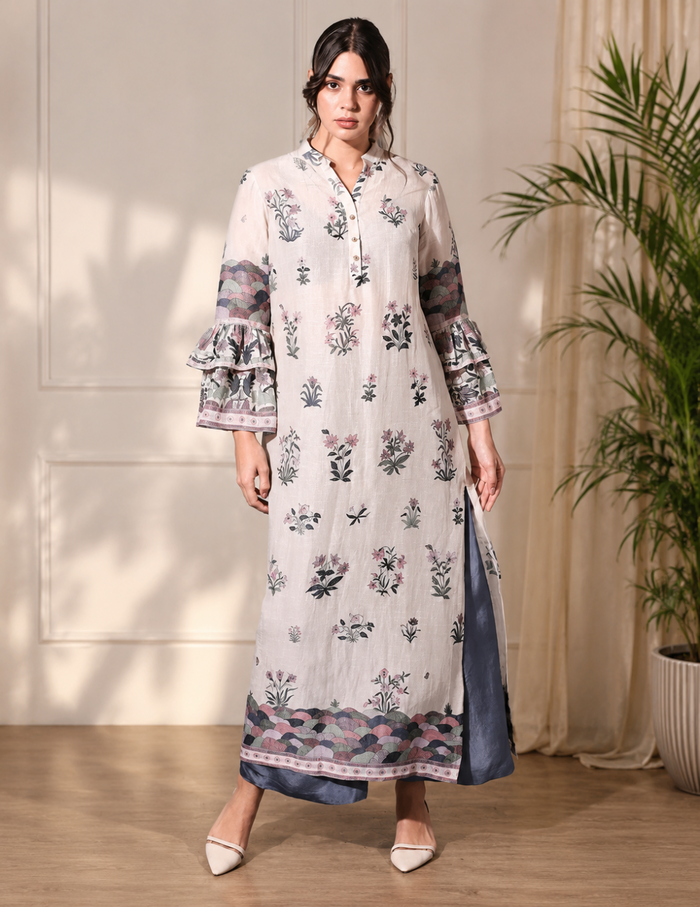 Pastel Floral Printed Top with bell sleeves paired with green twill pants for women, showcasing an elegant and contemporary floral co-ord silhouette.