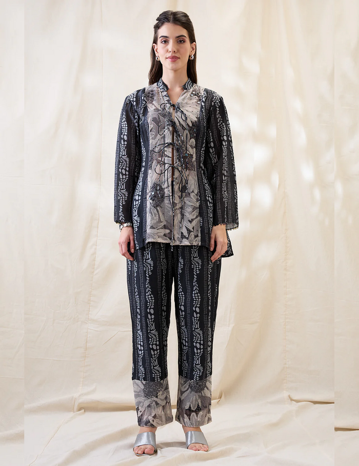 Black Noorani embellished shirt top with front tie-ups, slip and printed linen pants for women.
