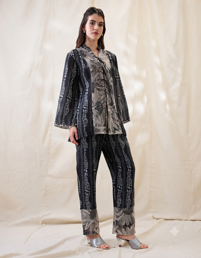 Black Noorani embellished shirt top with front tie-ups, slip and printed linen pants for women.