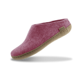 Blossom pink slipper with leather sole on a white background