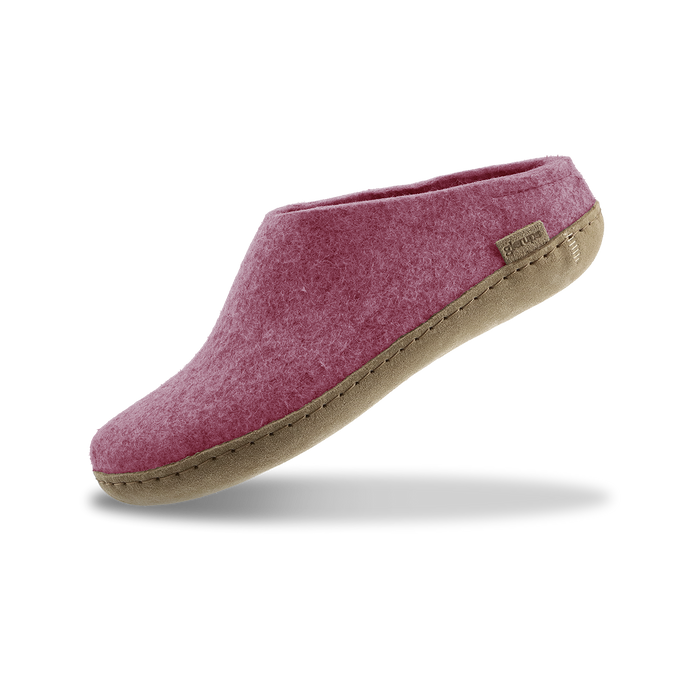 Blossom pink slipper with leather sole on a white background