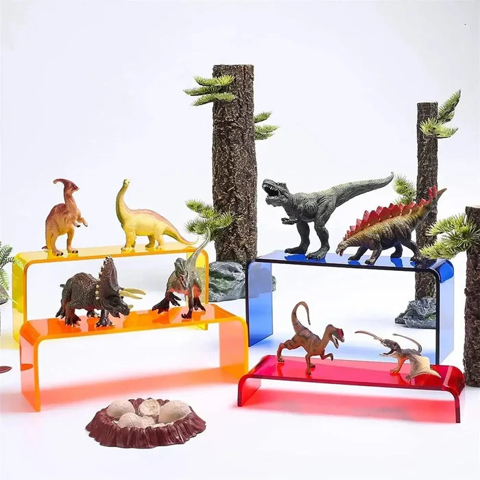 Dinosaur figurines on colorful shelves with tree accents and dinosaur eggs, perfect for home décor