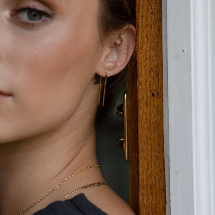 Model Styled in Gold Staple Earrings