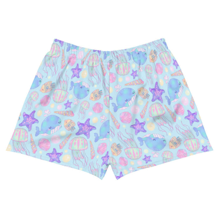 Under the Sea kawaii athletic short shorts in blue with peach-striped tropical fish and blue narwhals