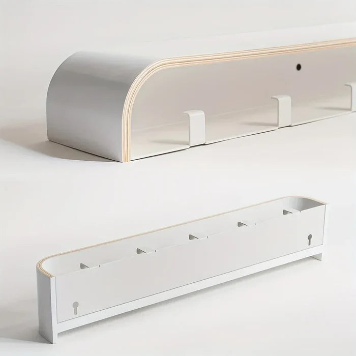 White wooden shelf with hooks on a light gray background