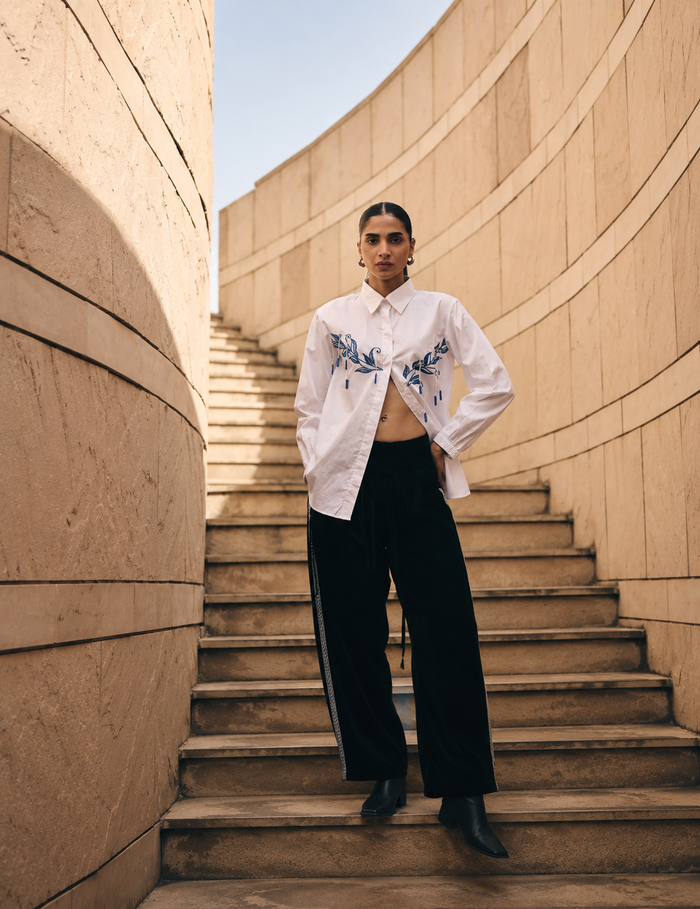 White Leaf Hue Embroidered Co-Ord Set featuring intricate blue floral embroidery on a premium cotton shirt paired with relaxed-fit tailored pants for an elegant contemporary look.